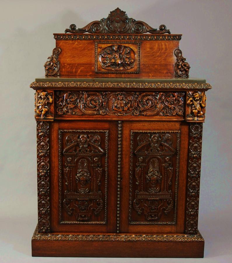 Oak cabinet with Renaissance carved panels