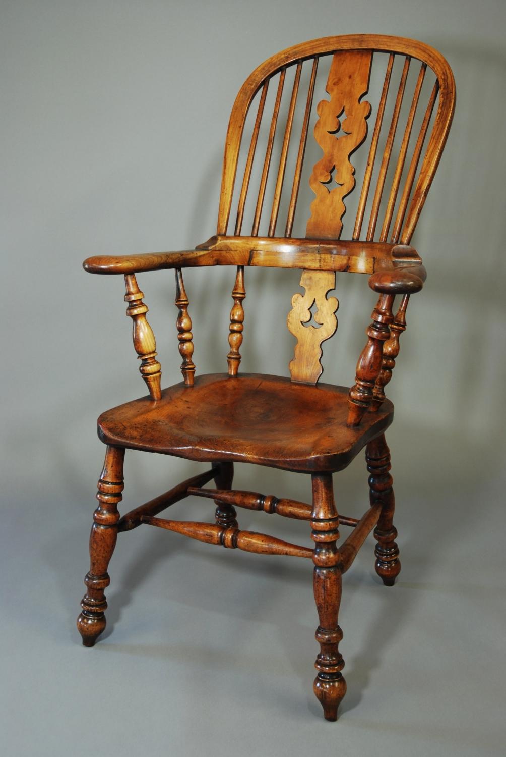Broad armed fruitwood high back Windsor chair