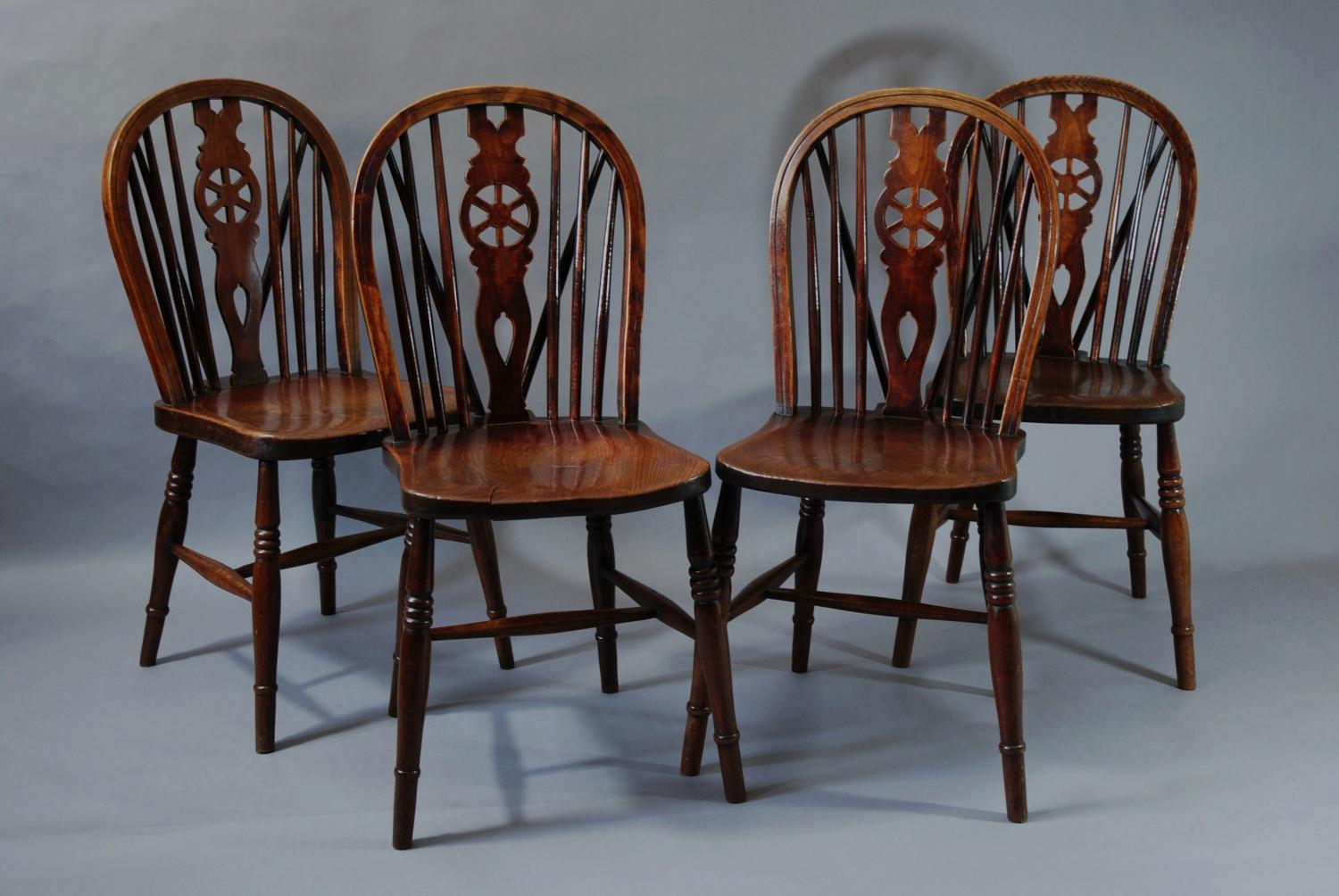 Set of four 19thc wheelback windsor chairs