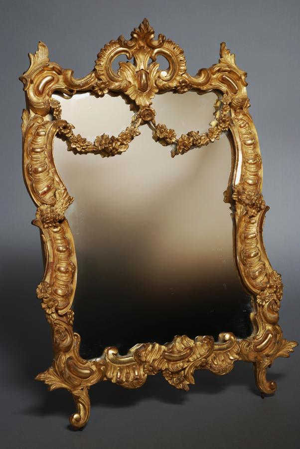 A late 19thc gilt wood and gesso mirror 