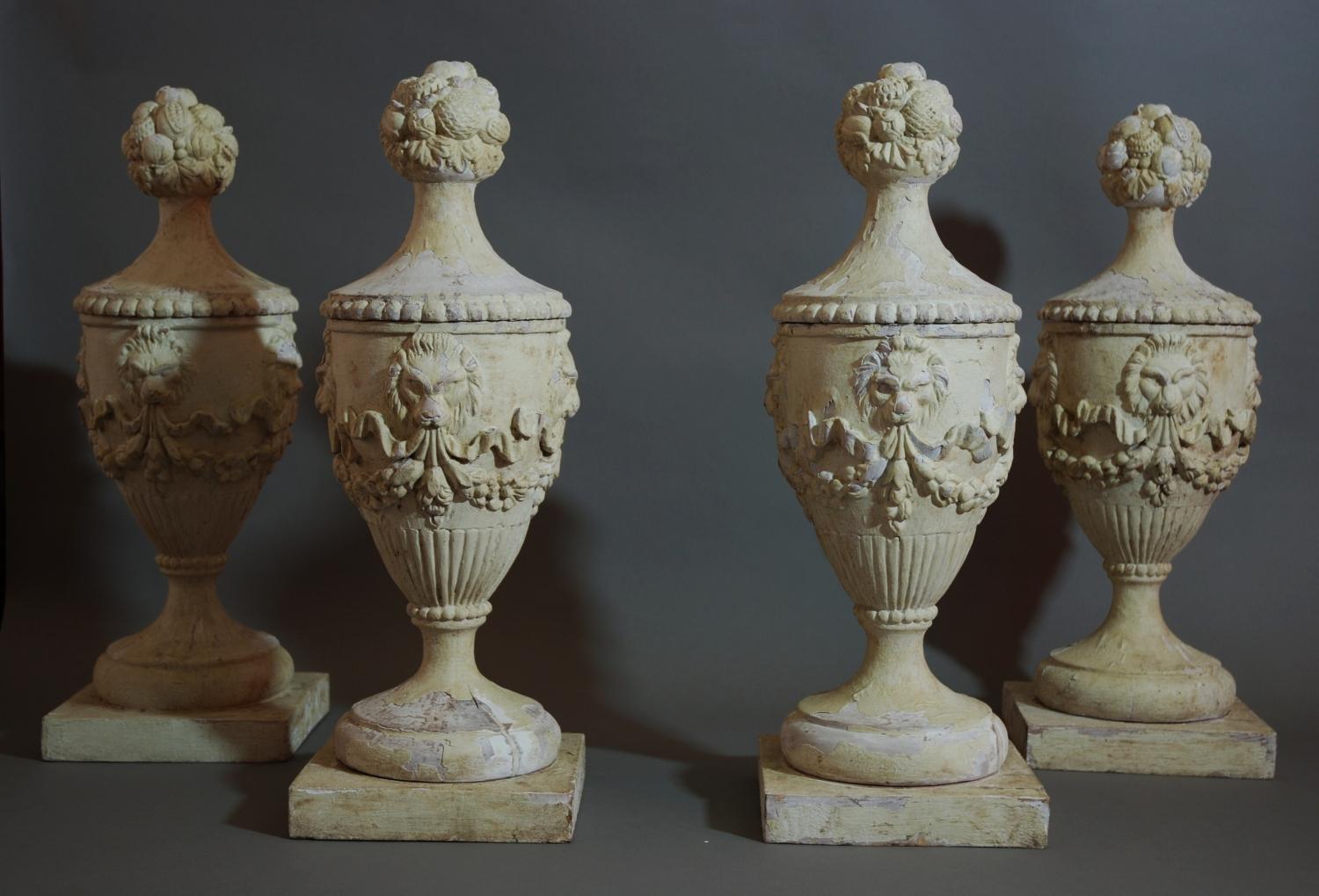 Set of four carved & painted wooden urns 