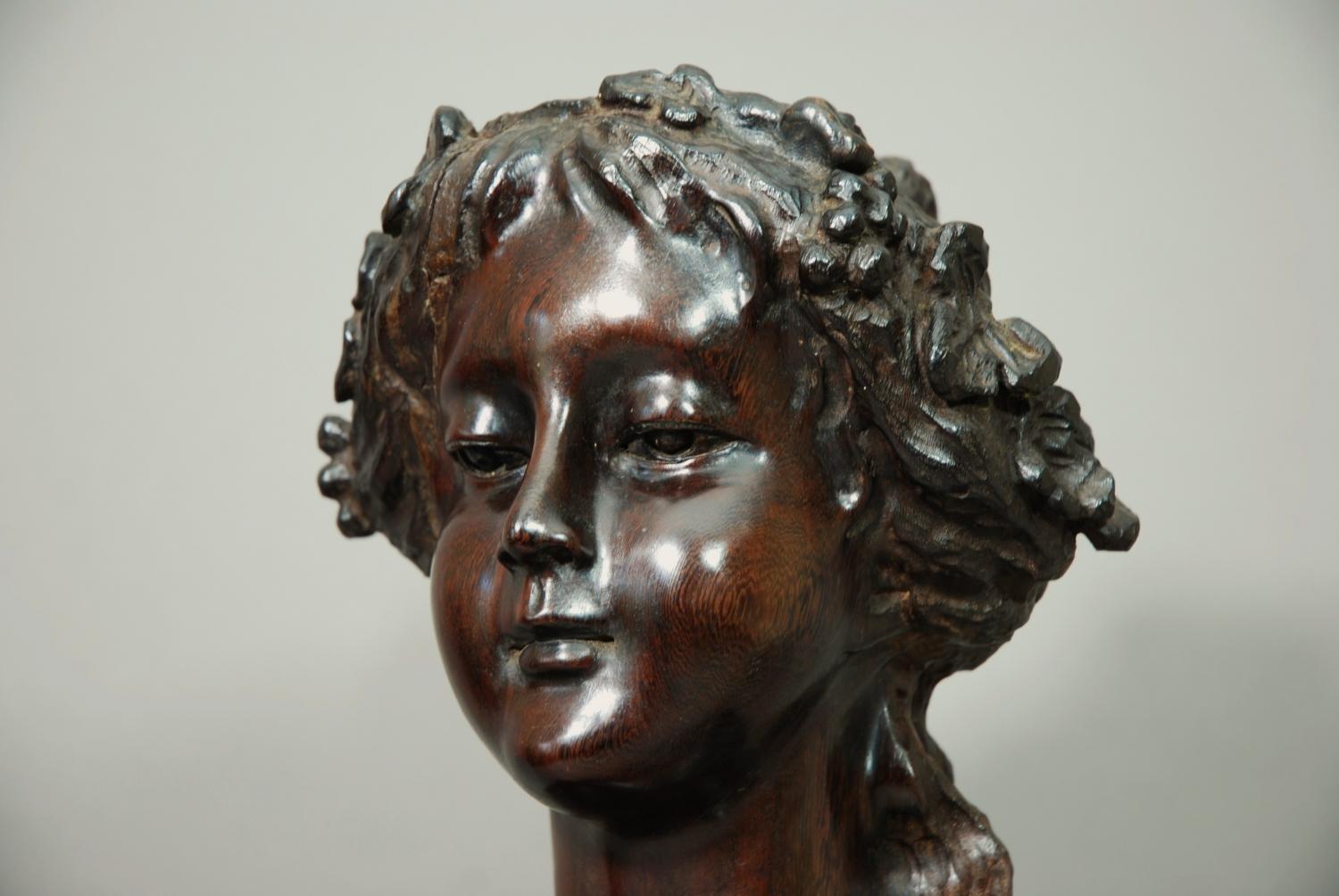 Carved wooden figure of a young bacchante