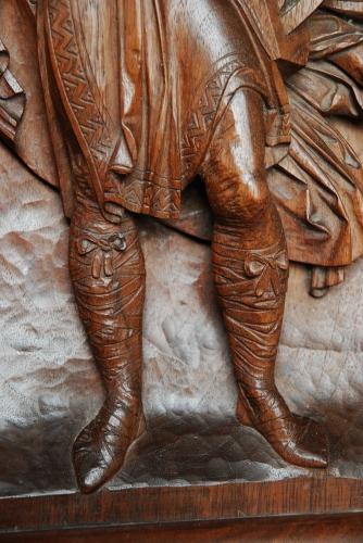 19thc carved walnut panel of Medieval man