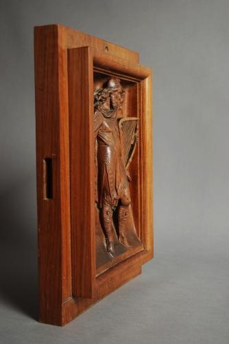 19thc carved walnut panel of Medieval man
