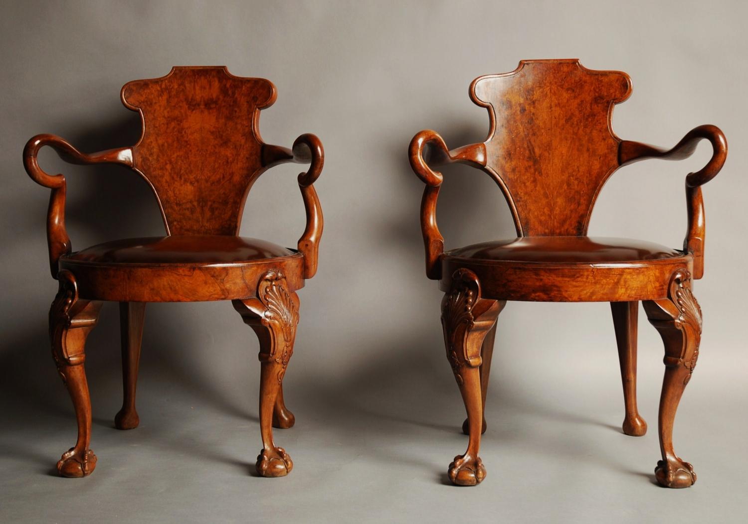 Pair of walnut open arm library chairs