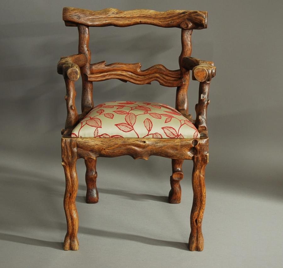 Rare mid 19th century carved elm armchair of naturalistic form