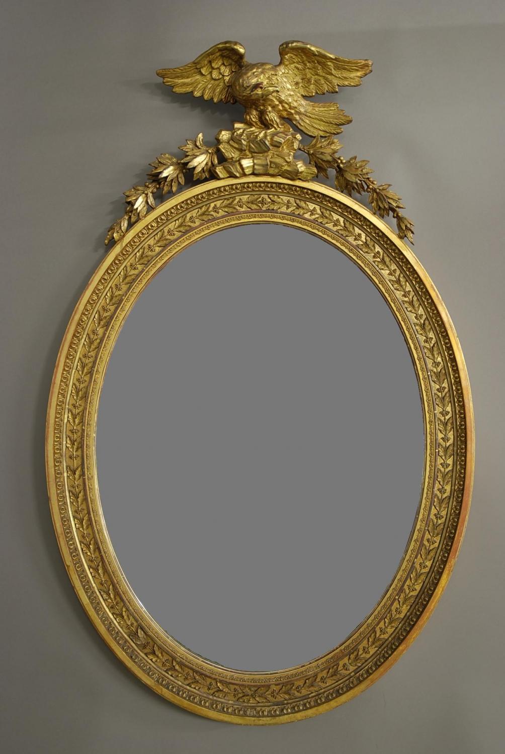 Late Regency large oval gilded mirror