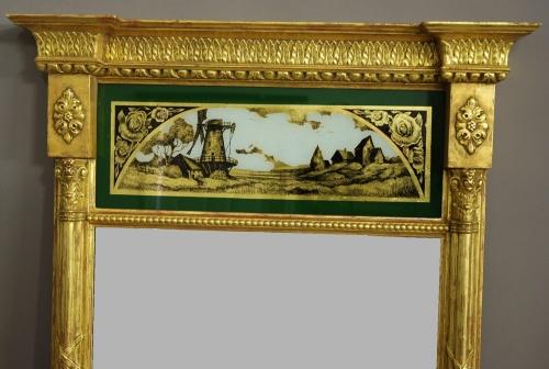 Regency style eglomise giltwood pier mirror