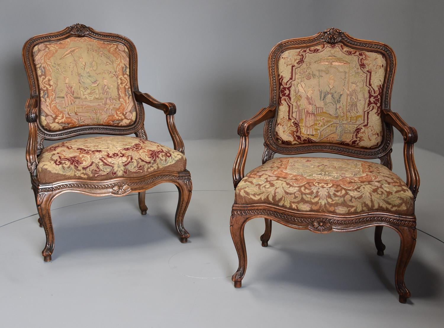 Pair of French fauteuils of large proportion with original needlework
