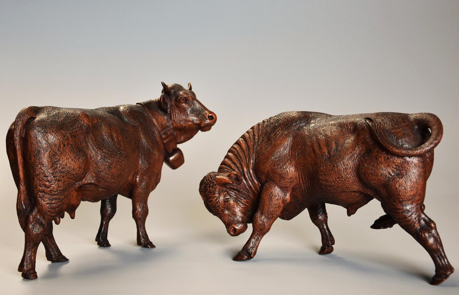 Pair of 19thc finely carved Black Forest cows, possibly by Huggler