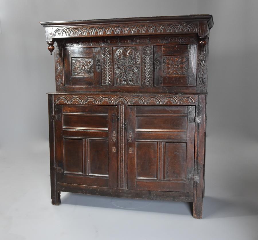 Wonderful mid 17thc carved oak press cupboard with superb patina