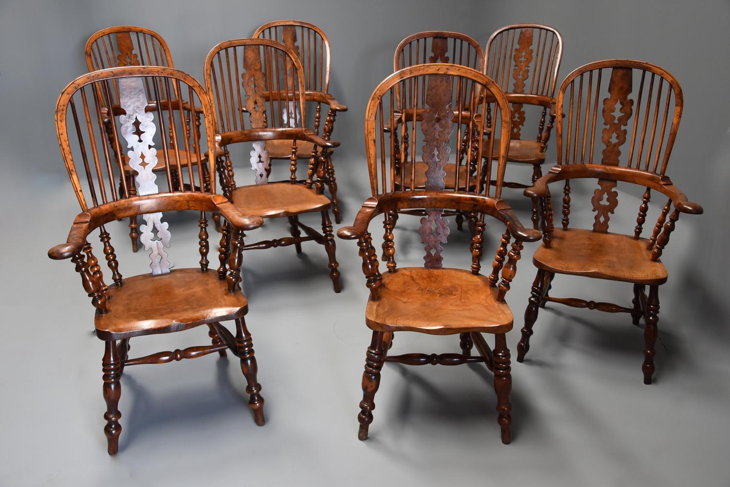 Superb set of eight 19thc broad arm burr yew high back Windsor chairs