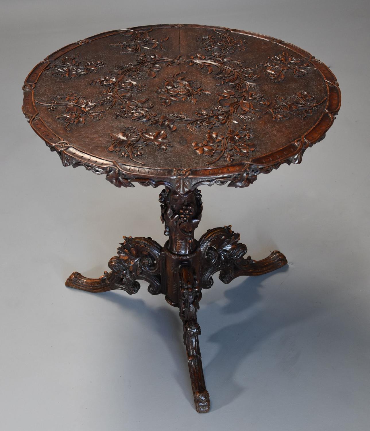 Late 19thc Black Forest carved linden wood centre table