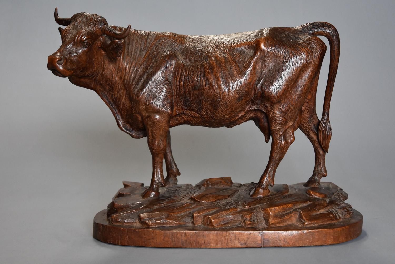 Finely carved 19thc linden wood Black Forest cow, possibly by Huggler