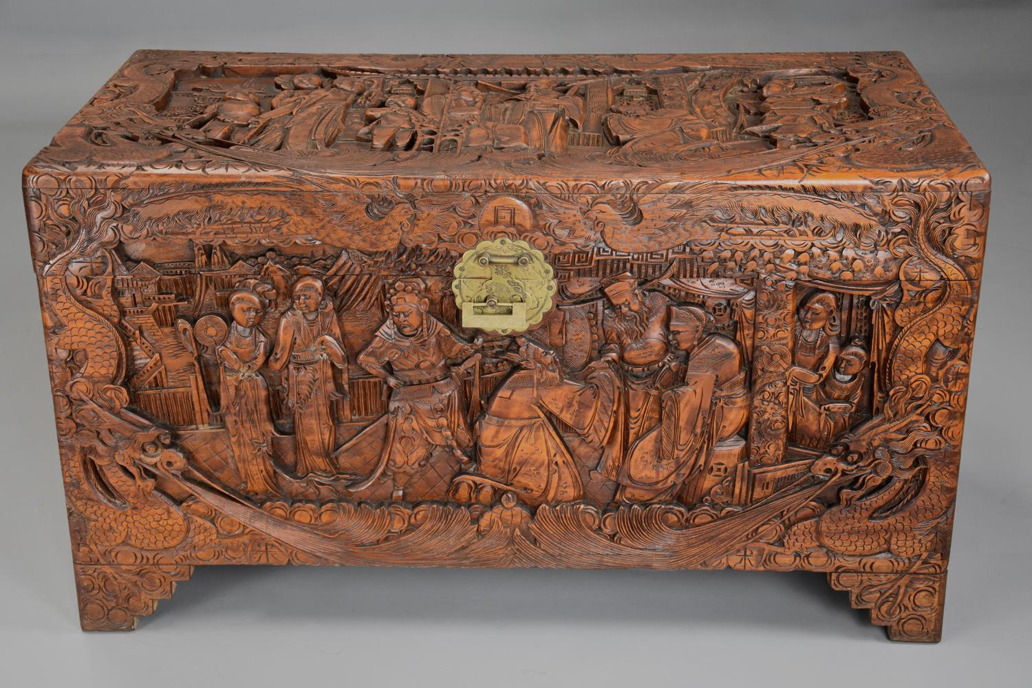 A highly decorative mid 20thc profusely carved Eastern camphor chest