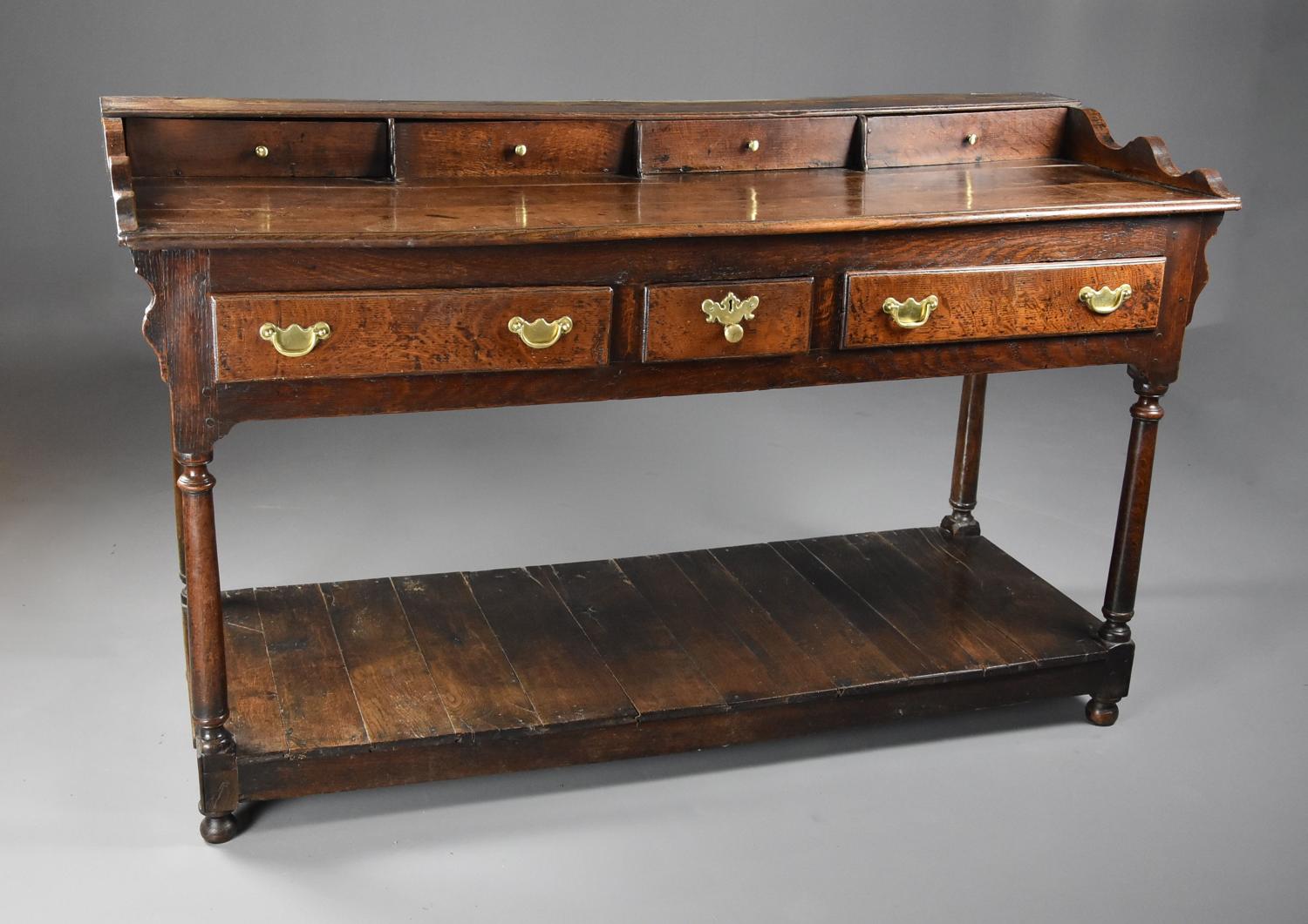 Mid 18th century oak potboard dresser base of superb patina