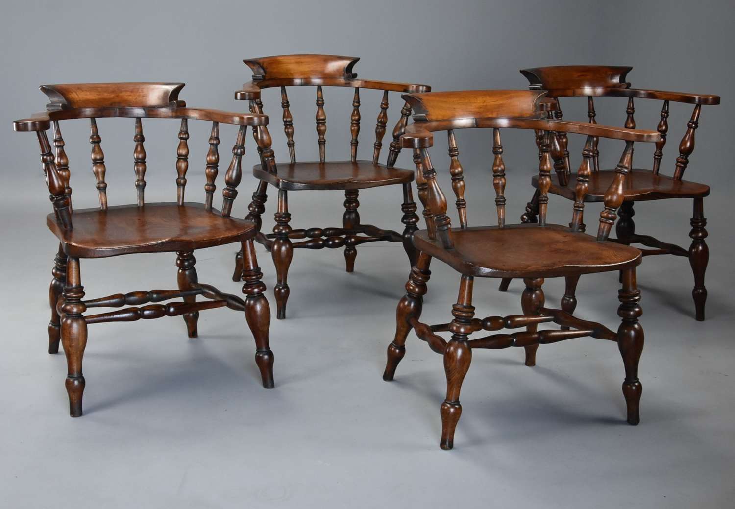 Set of four mid 19thc beech & elm smokers bow Windsor chairs