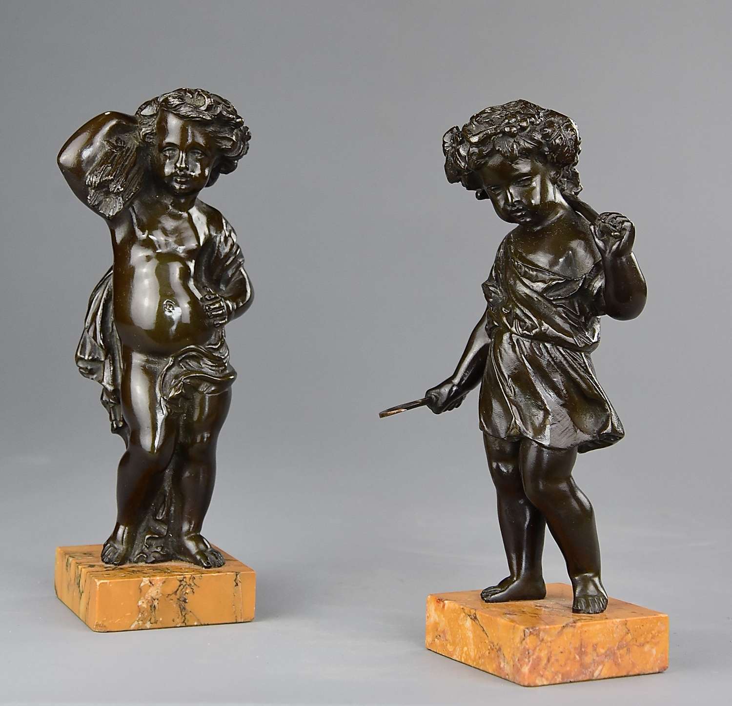 Pair of 19thc bronze Harvest putti in the manner of Clodion