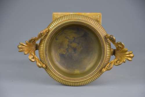 A pair of gilt metal tazzas on marble bases in the Neoclassical style