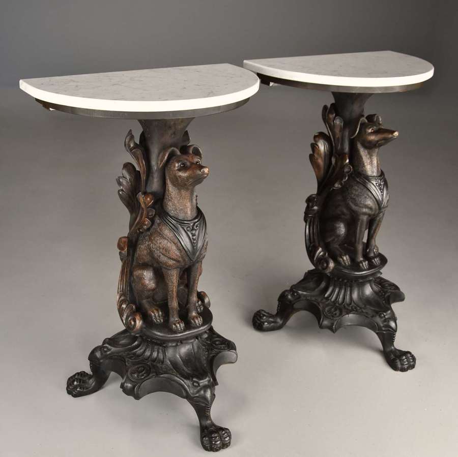 Rare pair of finely carved Black Forest hound side tables