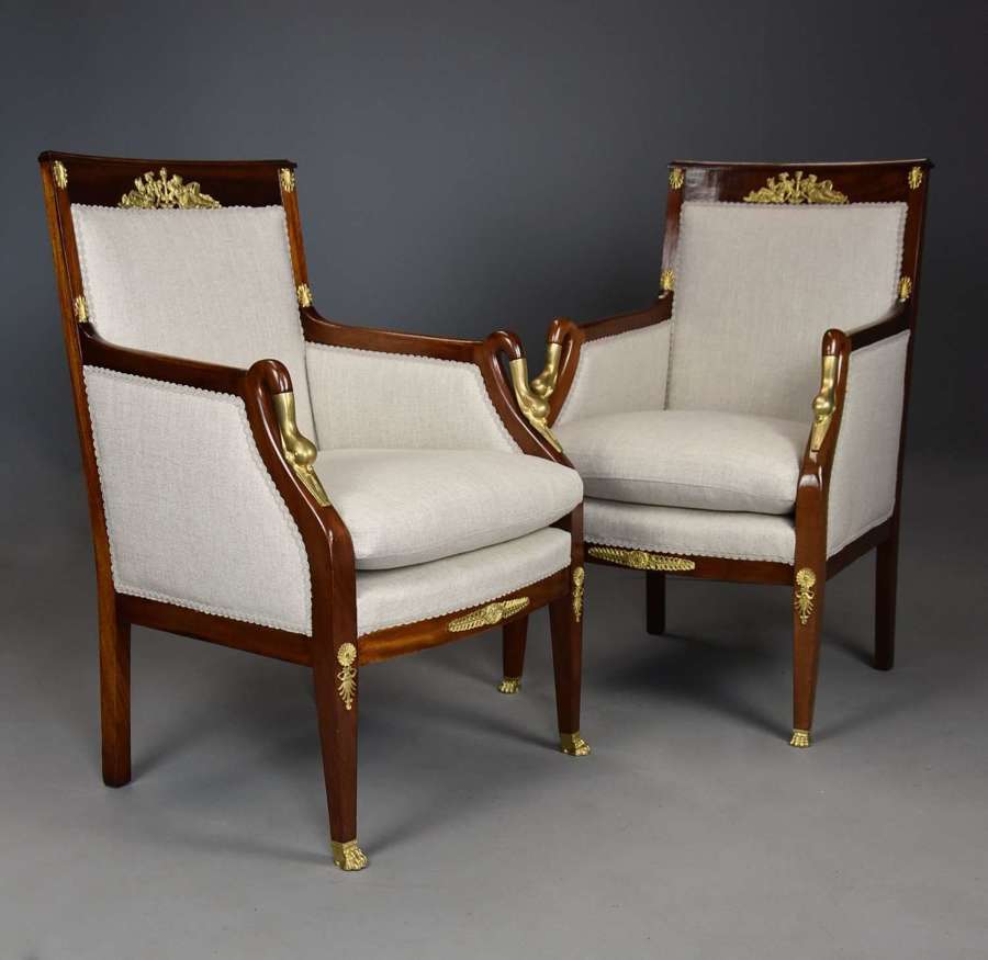 Pair of French Empire style mahogany upholstered armchairs