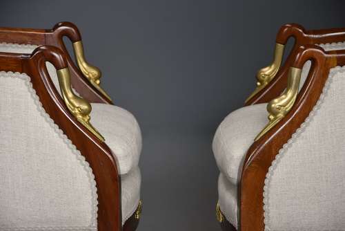 Pair of French Empire style mahogany upholstered armchairs