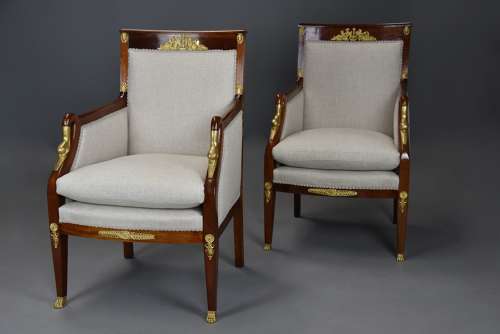 Pair of French Empire style mahogany upholstered armchairs