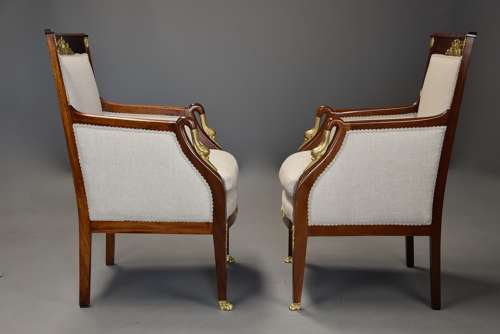 Pair of French Empire style mahogany upholstered armchairs