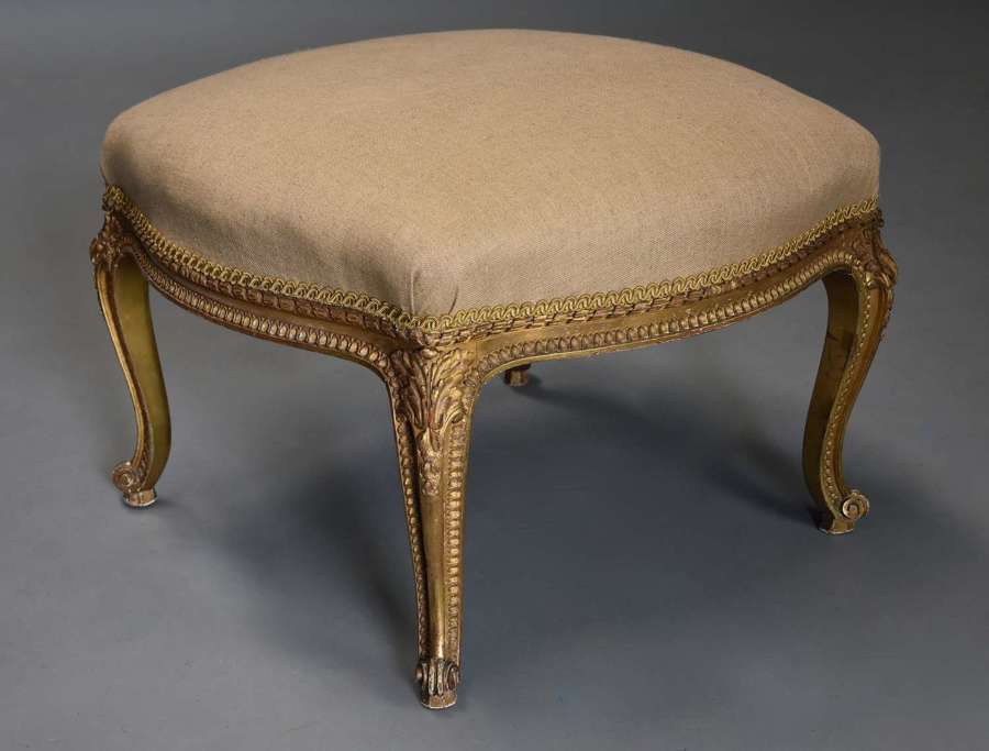 Large 19thc French carved giltwood stool with upholstered shaped seat