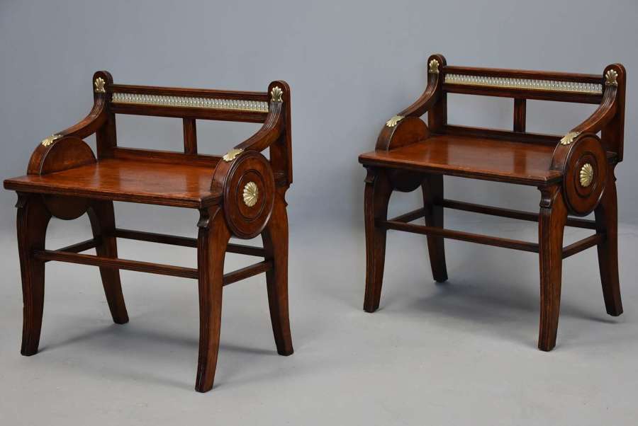 Pair of late 19th century oak hall benches by James Shoolbred & Co.