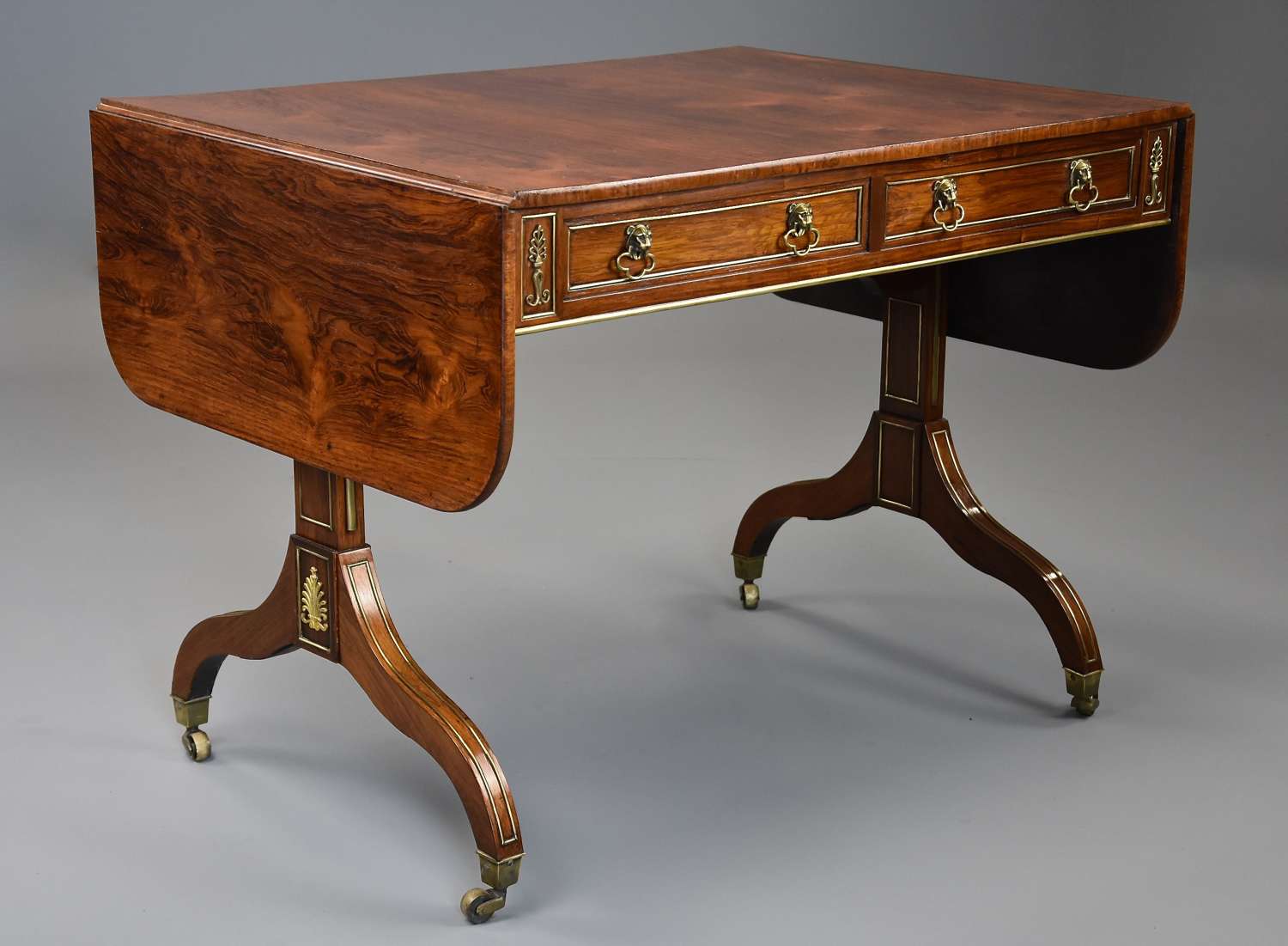 Fine quality English Regency rosewood and brass sofa table
