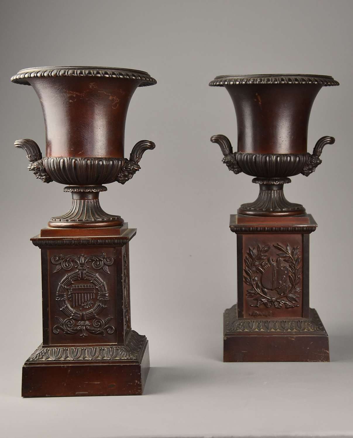 Pair of French late 19thc spelter campana urns on plinth bases