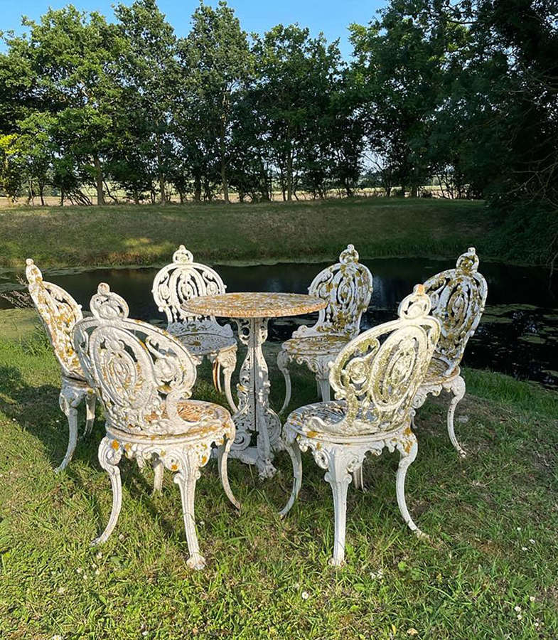 Set of six 19thc cast iron garden chairs & Coalbrookdale garden table