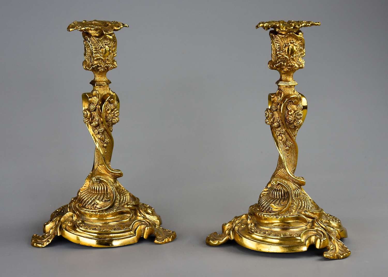 Pair of 19thc French brass candlesticks in the Rococo style