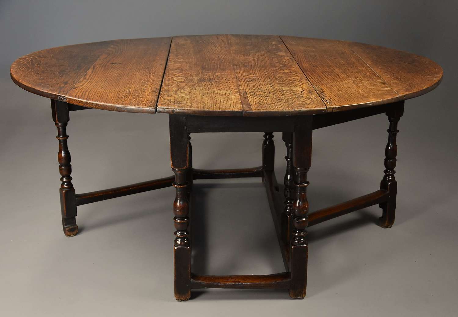 Large early 18th century oak gateleg table of exceptional patina