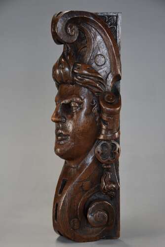 Late 17th century carved oak corbel in the style of a Medieval man, possibly Continental