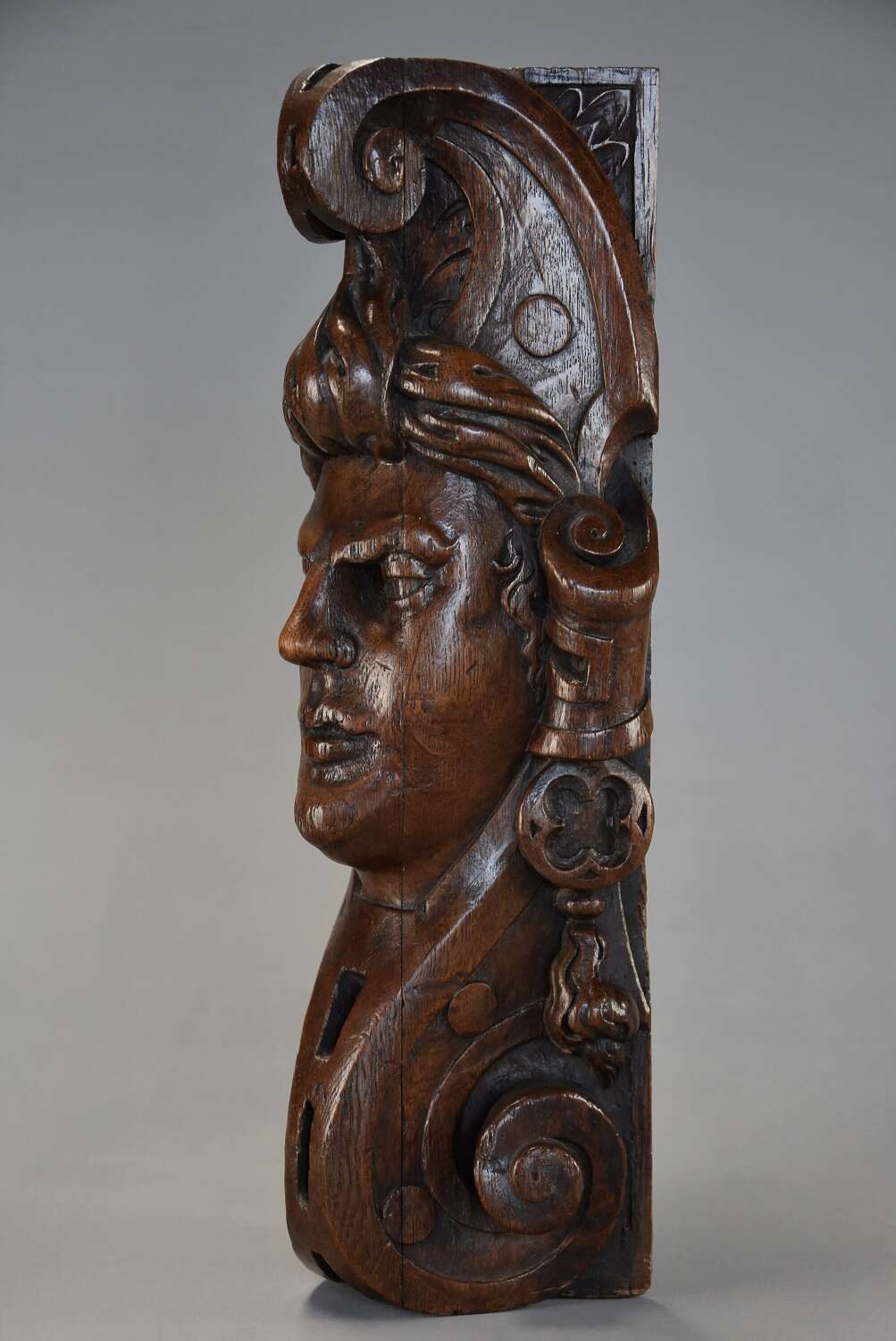 Late 17th century carved oak corbel in the style of a Medieval man, possibly Continental
