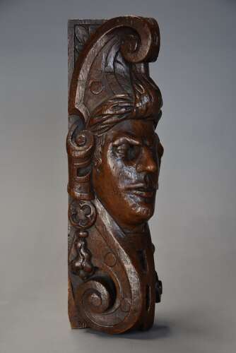 Late 17th century carved oak corbel in the style of a Medieval man, possibly Continental