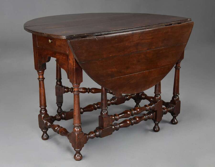 Rare early 18th century walnut gateleg table of fine patina