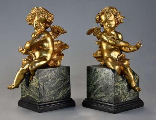 Pair of fine quality early 19thc French ormolu winged cherubs seated on faux marble bases