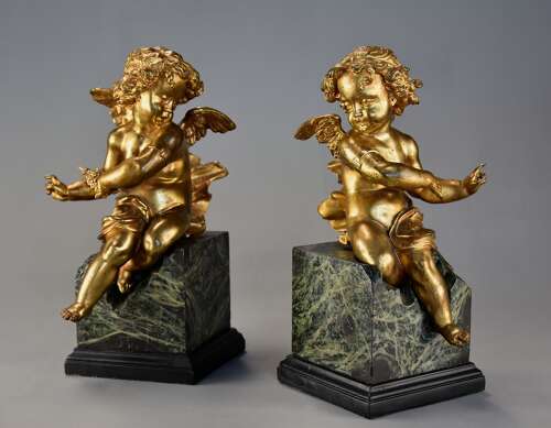 Pair of fine quality early 19thc French ormolu winged cherubs seated on faux marble bases