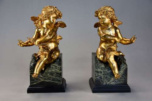 Pair of fine quality early 19thc French ormolu winged cherubs seated on faux marble bases