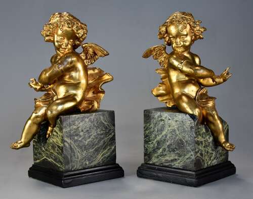 Pair of fine quality early 19thc French ormolu winged cherubs seated on faux marble bases