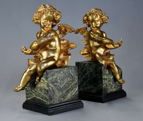 Pair of fine quality early 19thc French ormolu winged cherubs seated on faux marble bases