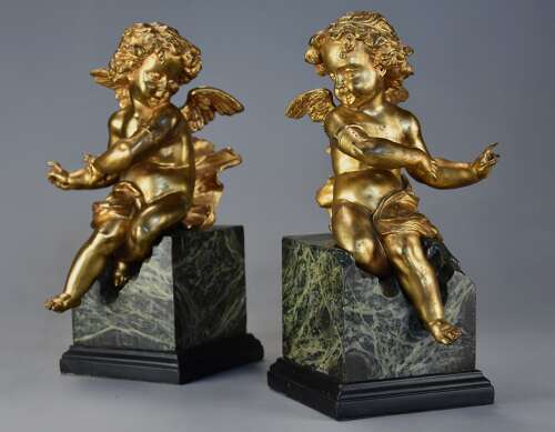 Pair of fine quality early 19thc French ormolu winged cherubs seated on faux marble bases