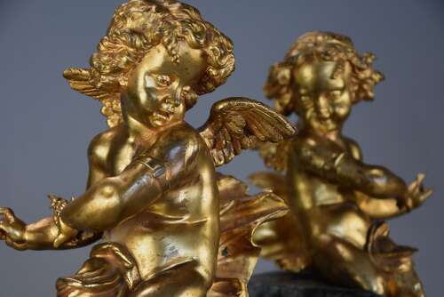 Pair of fine quality early 19thc French ormolu winged cherubs seated on faux marble bases