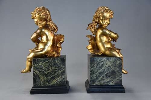 Pair of fine quality early 19thc French ormolu winged cherubs seated on faux marble bases