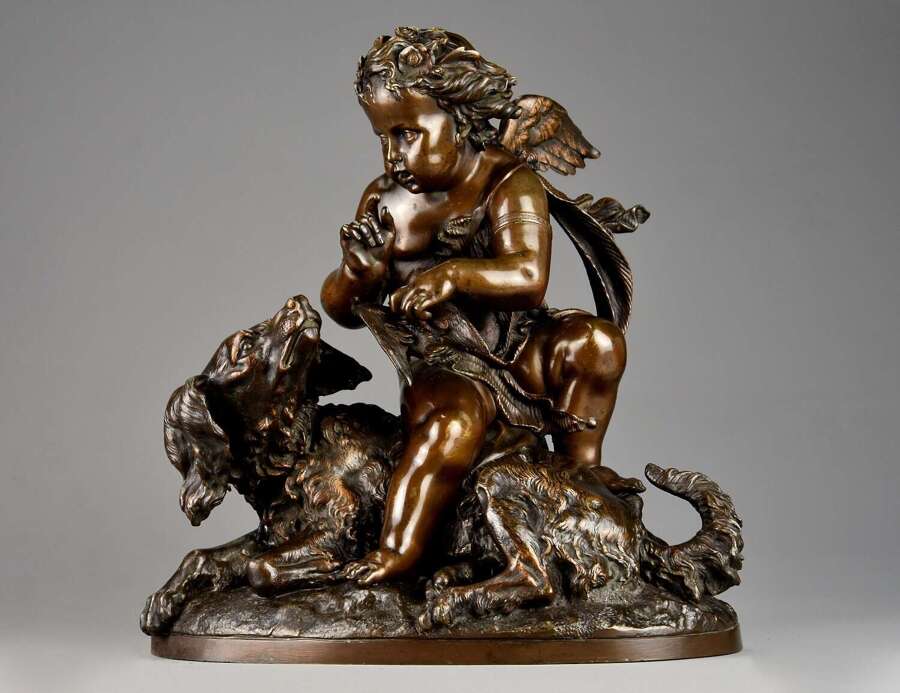 Charming late 19th century fine quality French bronze of a winged putto and spaniel dog